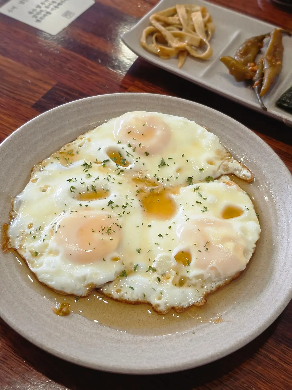Fried egg drizzled generously with perilla oil
