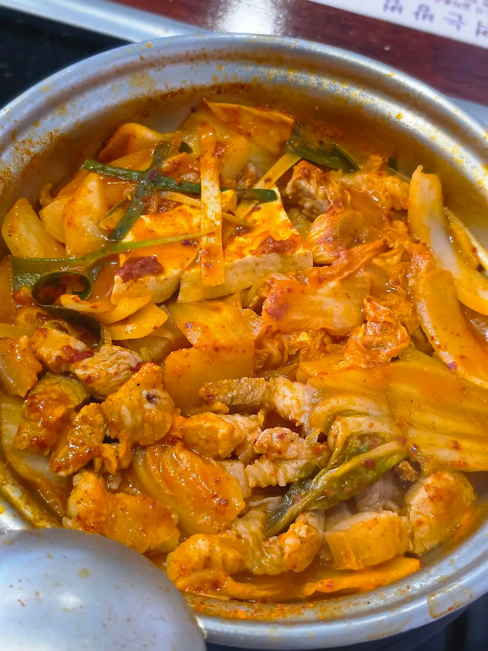 Reduced, rich kimchi jjigae after 7 minutes of boiling