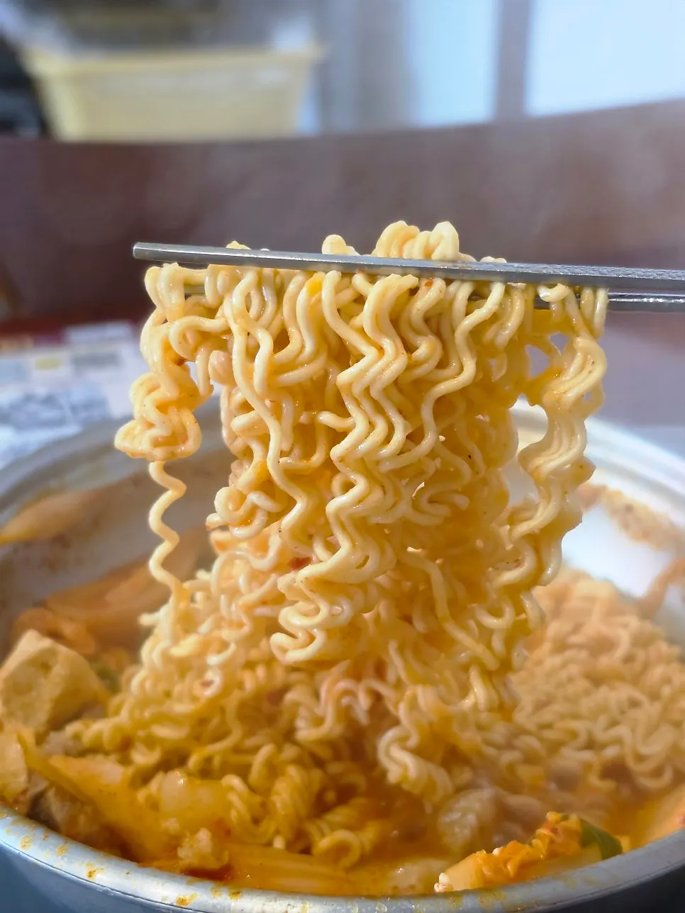 Ramyeon noodles added into the kimchi jjigae