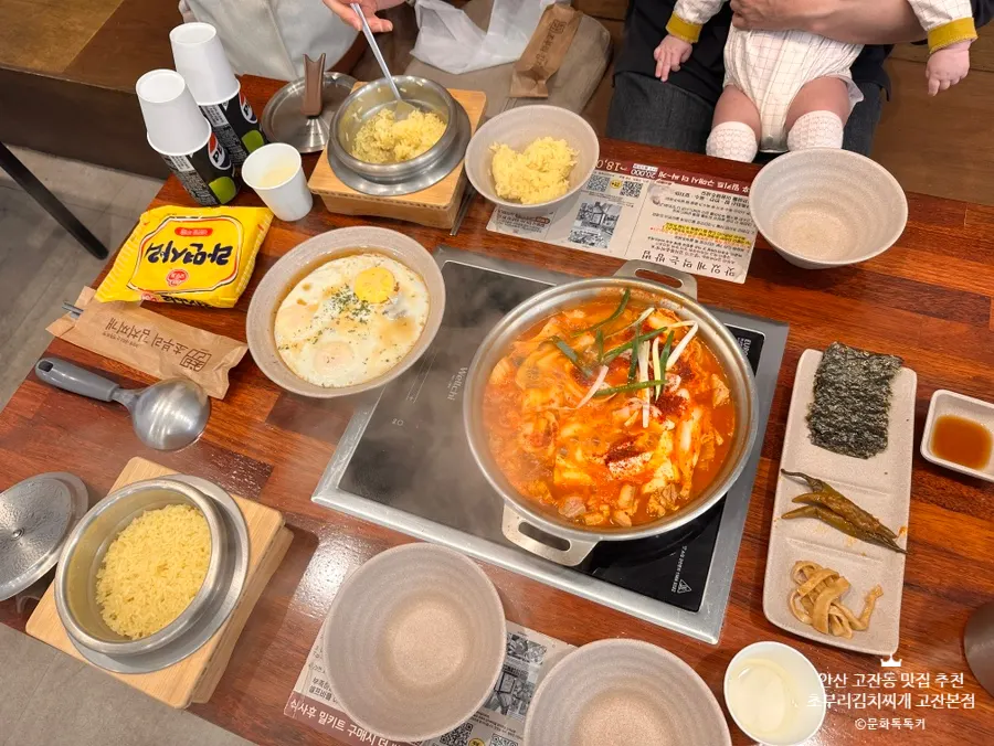 A full spread of kimchi jjigae and stone-pot rice at Choburi Kimchi Jjigae Gojan Main Branch