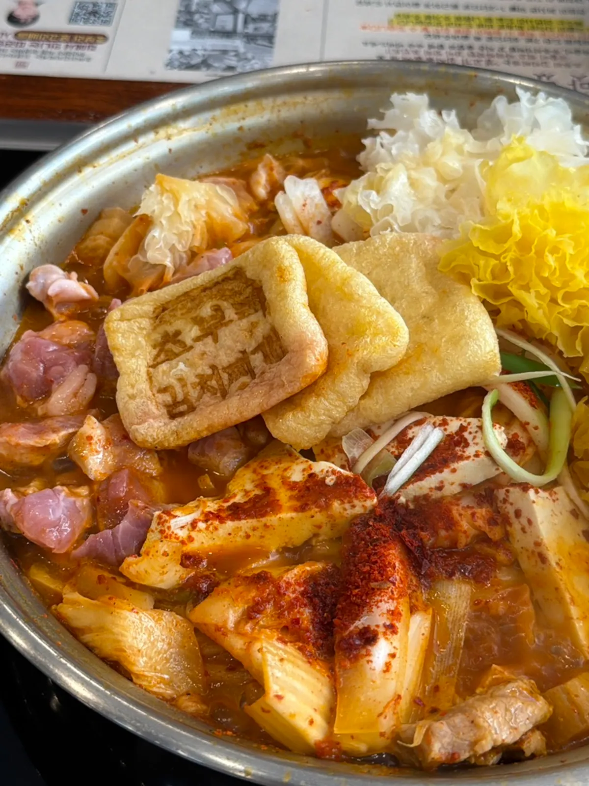 Kimchi jjigae pot cooking directly on the induction burner