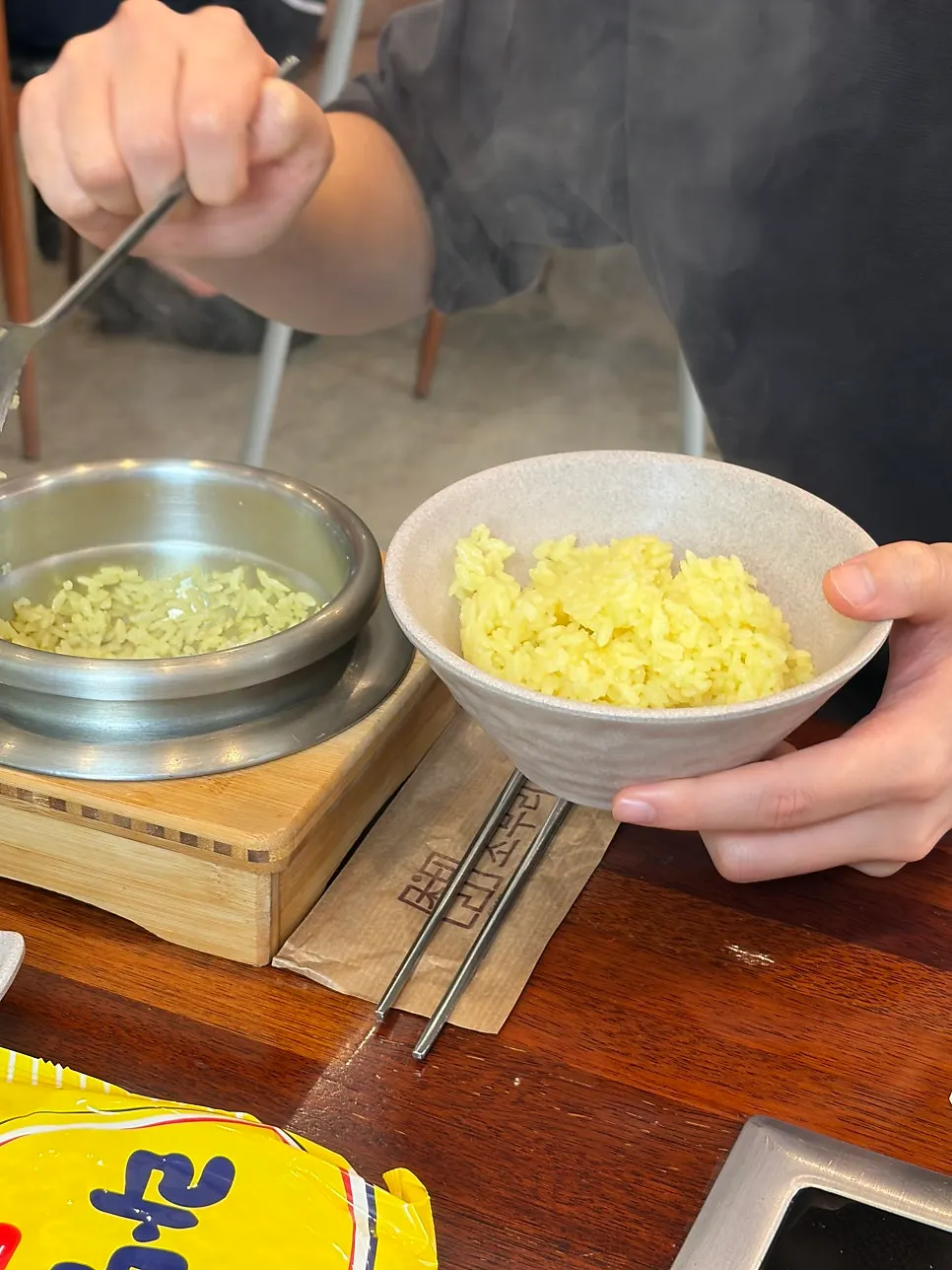 Freshly cooked golden gardenia stone-pot rice