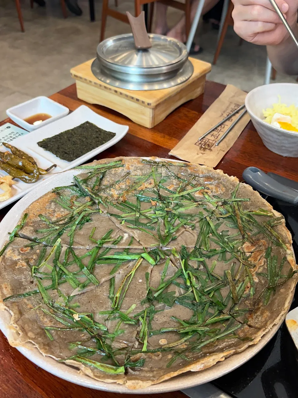 Water poured over the scorched rice crust in the stone pot