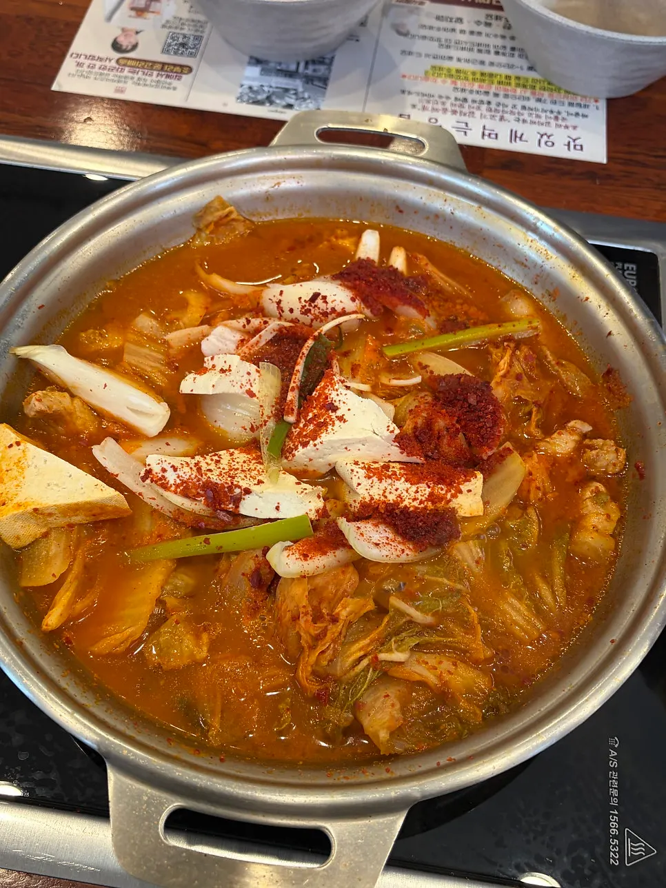 Pot of kimchi jjigae starting to boil