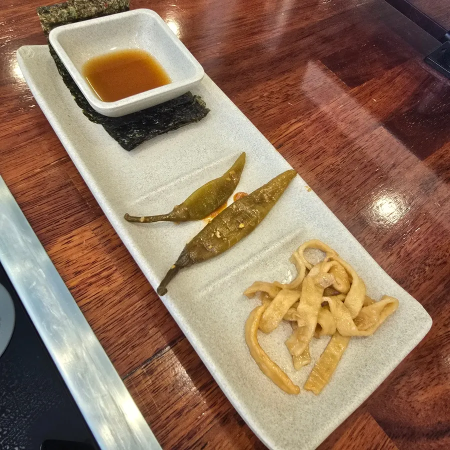 Basic side dishes: seaweed, soy sauce, pickled peppers, stir-fried fish cake