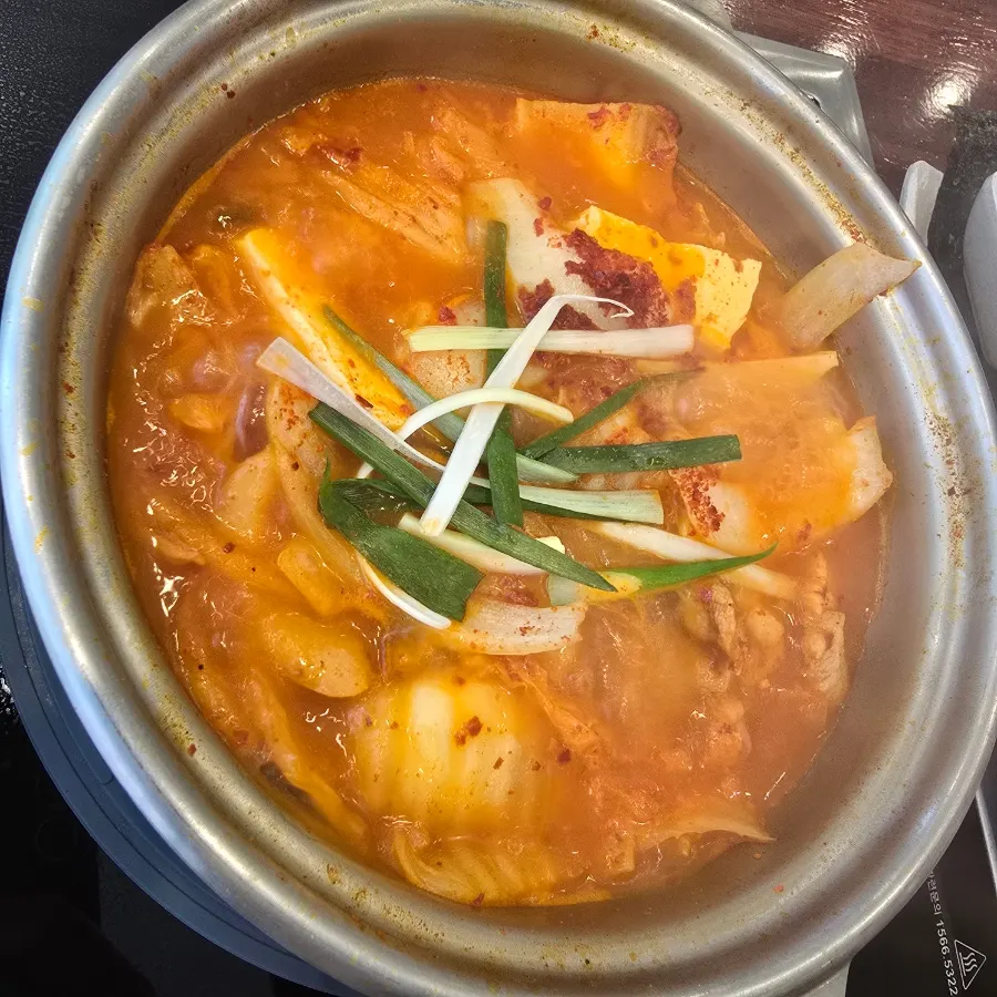 Kimchi jjigae broth with skin-on pork meat