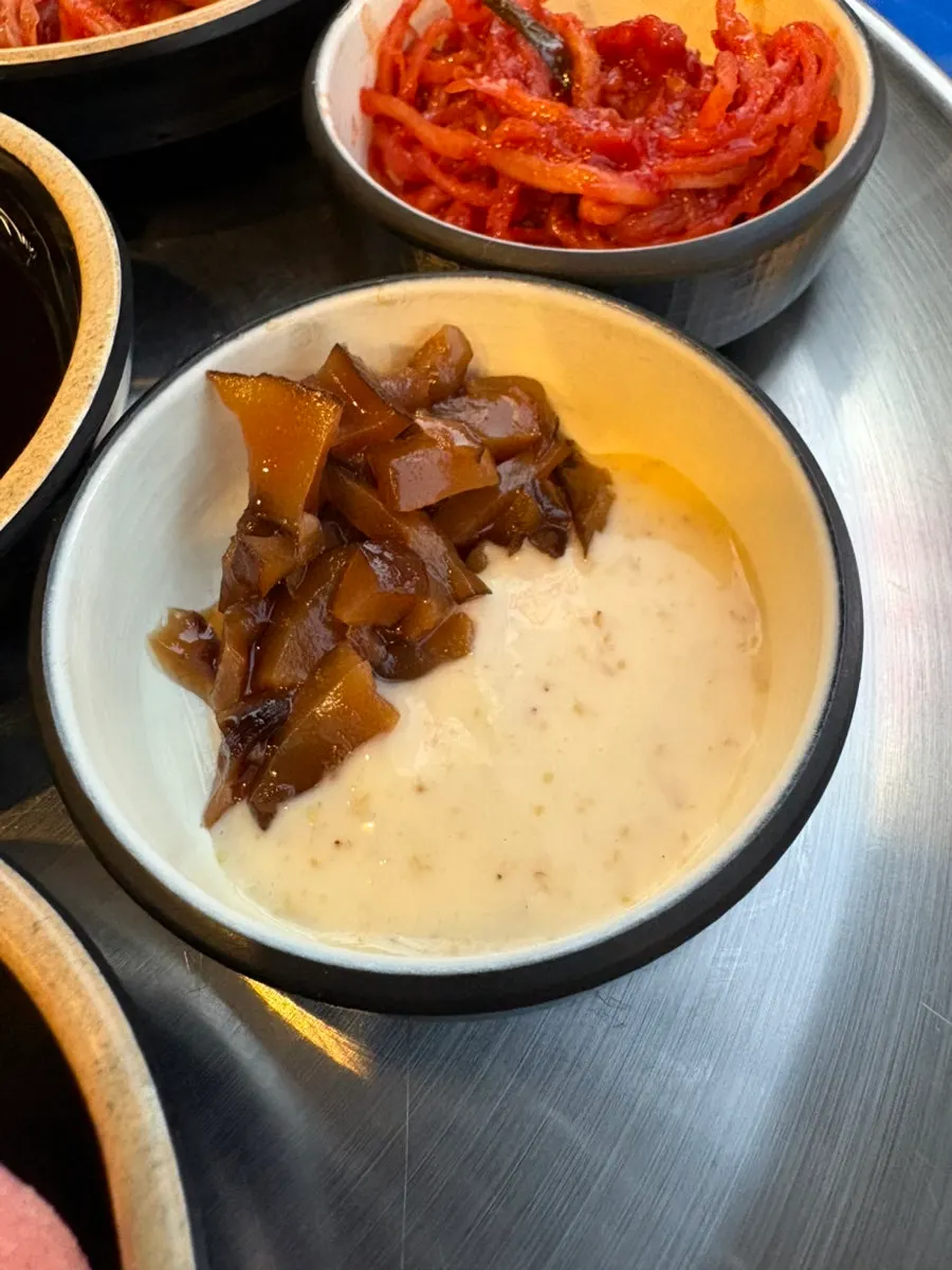 Plates of kimchi and radish salad side dishes