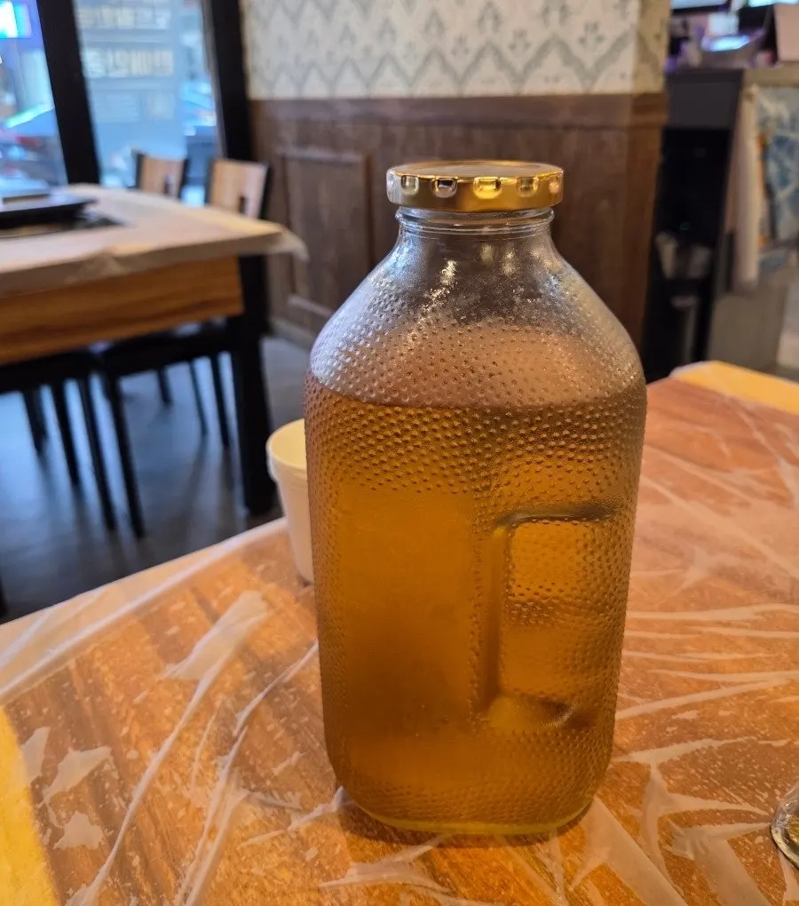 Tea served in a retro orange bottle