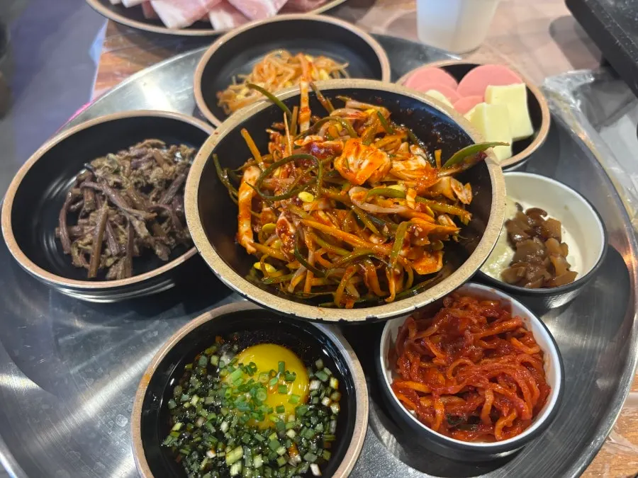 Full spread of side dishes on a retro tray