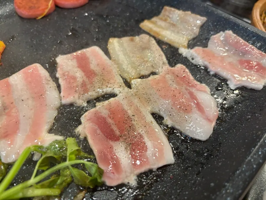 Pork belly with minari and king oyster mushrooms on the grill