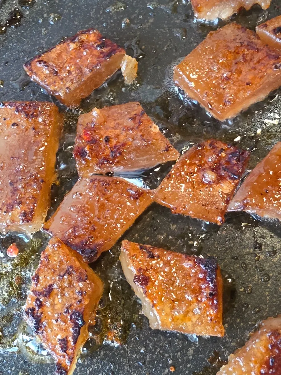 A piece of pork skin grilled crisp on the outside