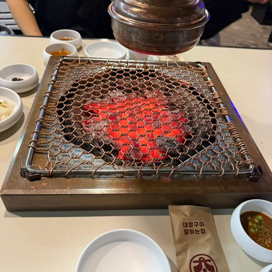 Tabletop grill with fire lit at Chodaechang Baekseok Branch