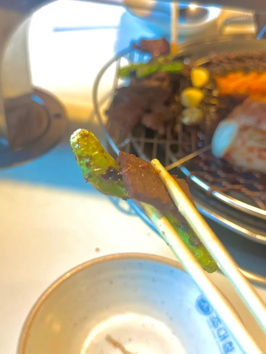 Shishito-style peppers grilled alongside the heart