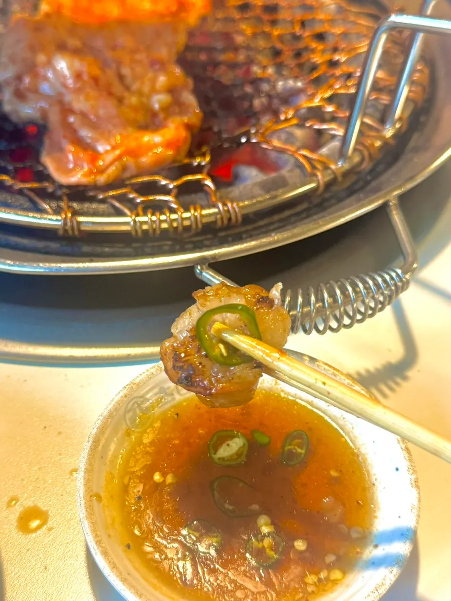 Close-up of daechang with a smoky charcoal-grilled finish