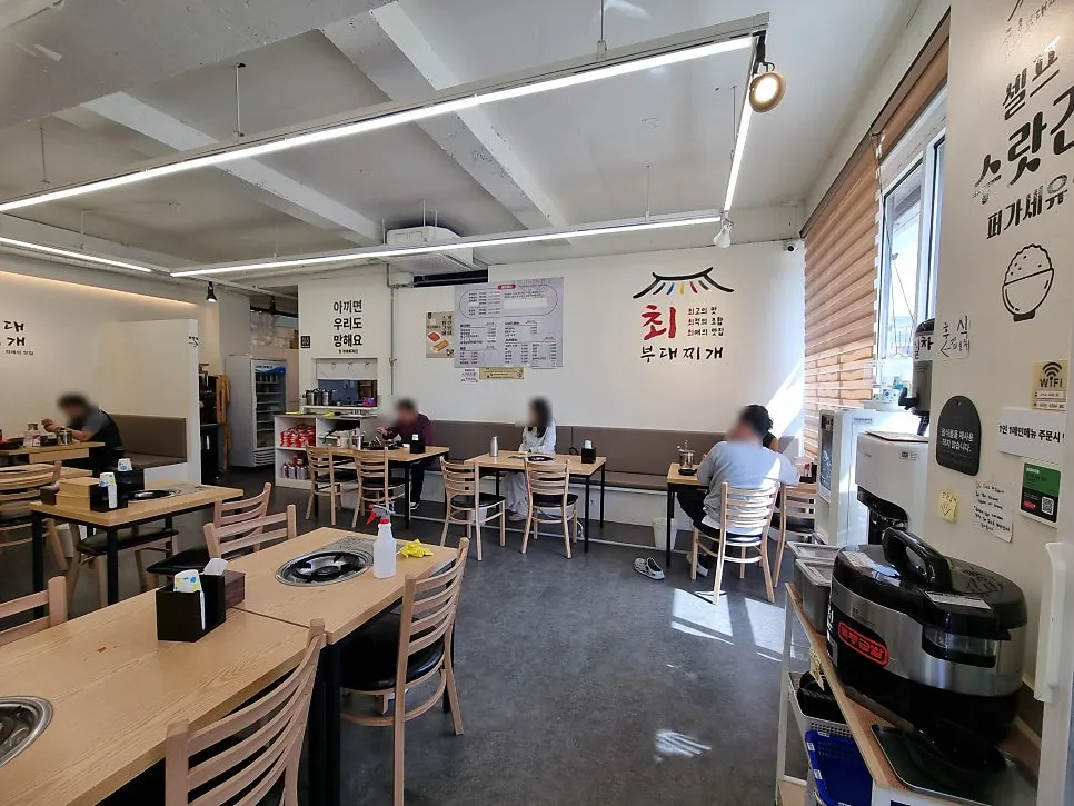 Long rows of group seating at Choi Budae Jjigae