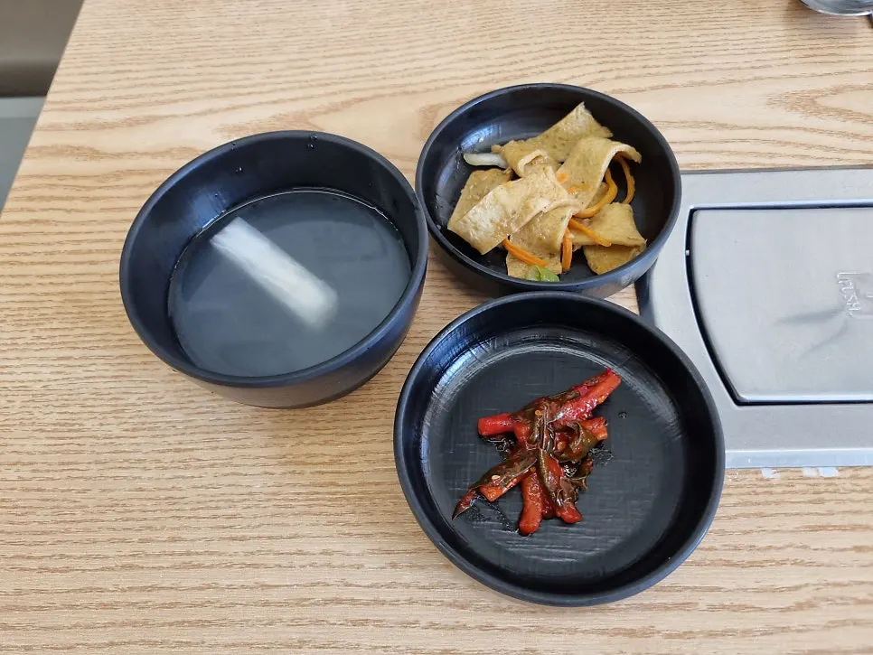 Basic banchan set out after ordering at Choi Budae Jjigae