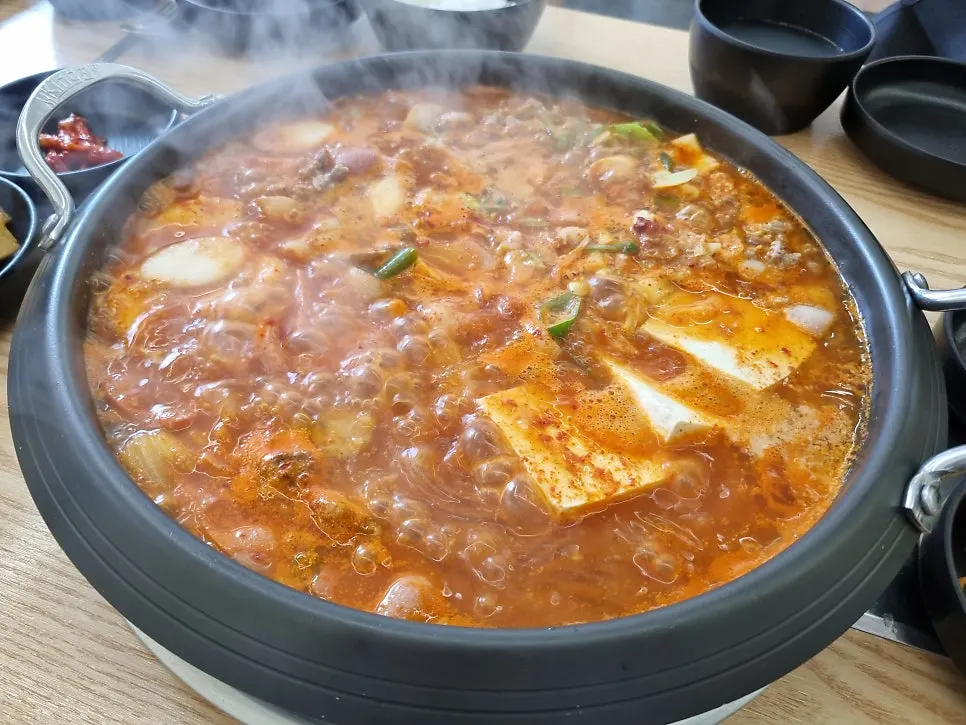 Choi Budae Jjigae simmering on the burner