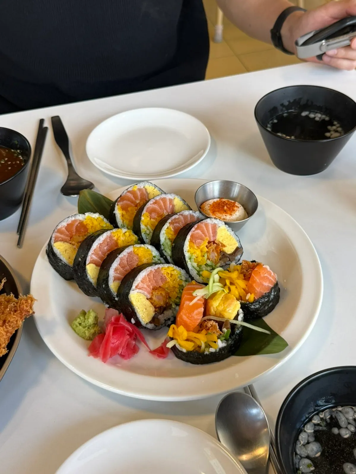 Table set with aged salmon futomaki and bone-in pork katsu
