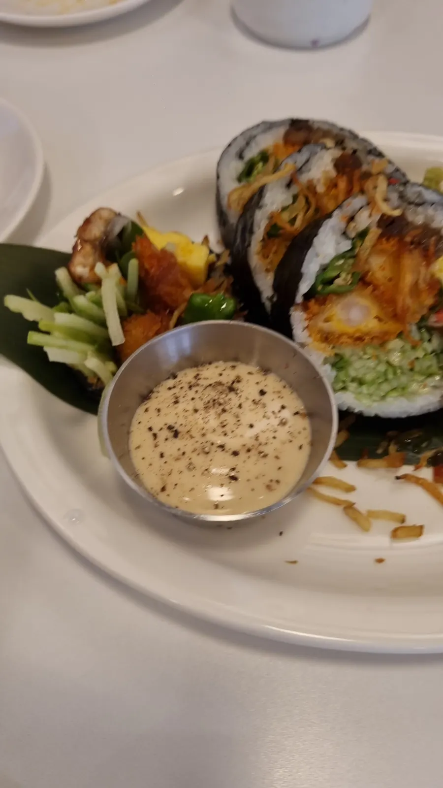 A plate of vibrant, colorful futomaki