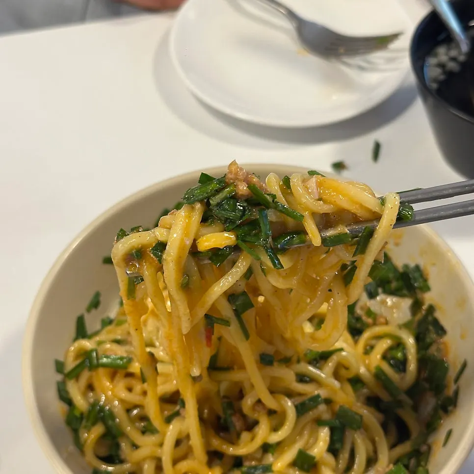 Maze soba mixed with a broken egg yolk