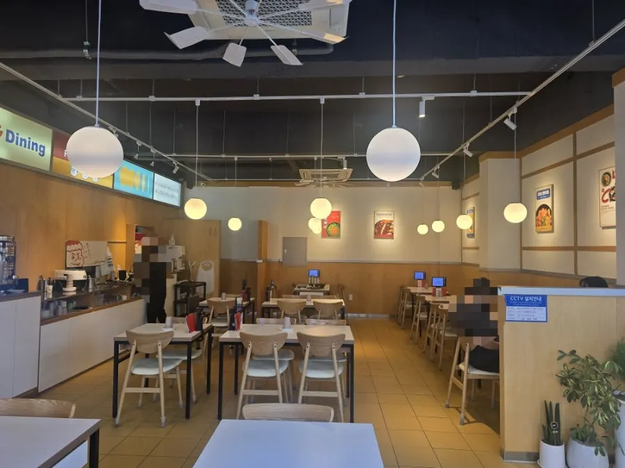 Wood-tone interior of Choi Dining Daejeon Gwanpyeong
