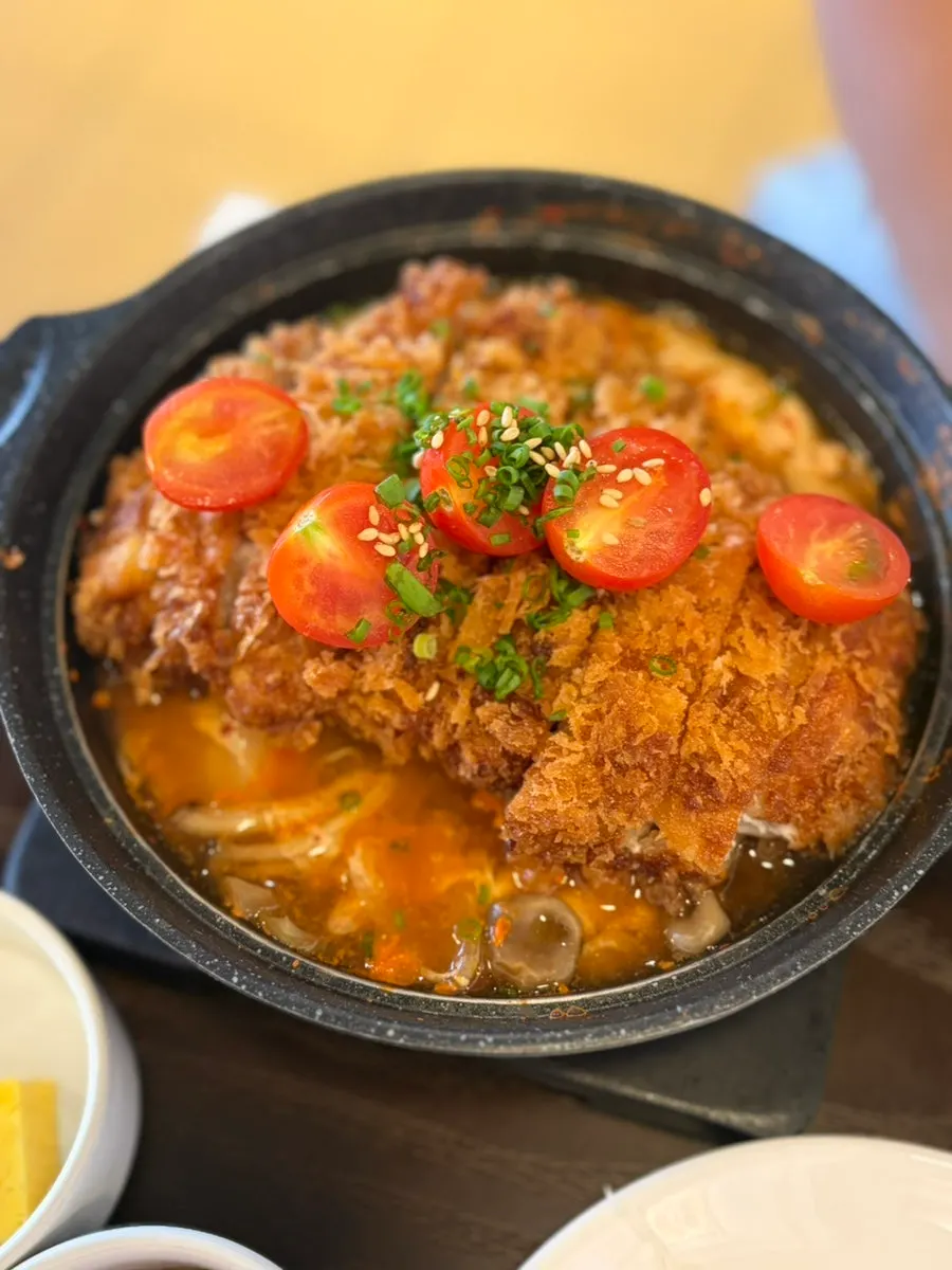 Kimchi katsudon topped with thick pork cutlet