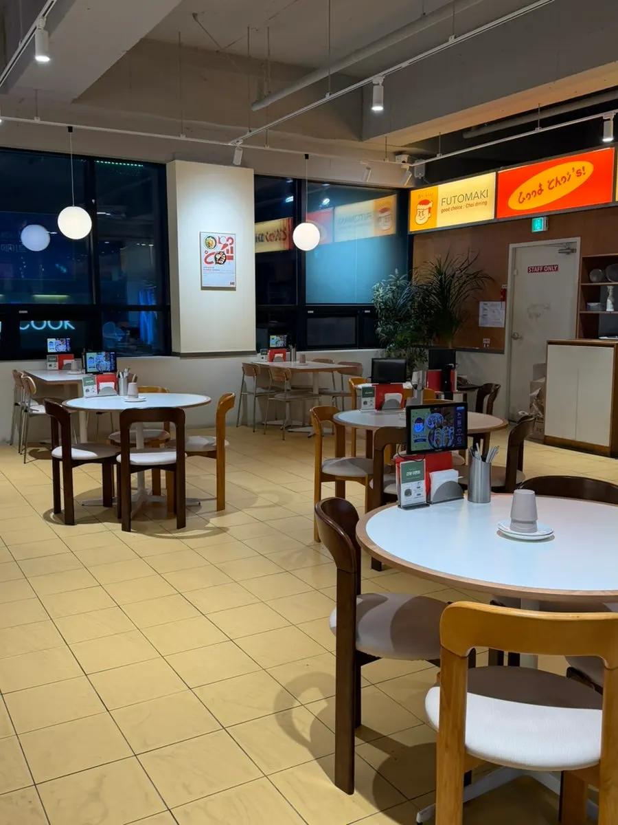 Entrance of Choi Dining on the 2nd floor of Bujaro Tower with illustration