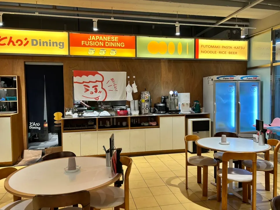Wide view of the dining hall with spaced-out tables