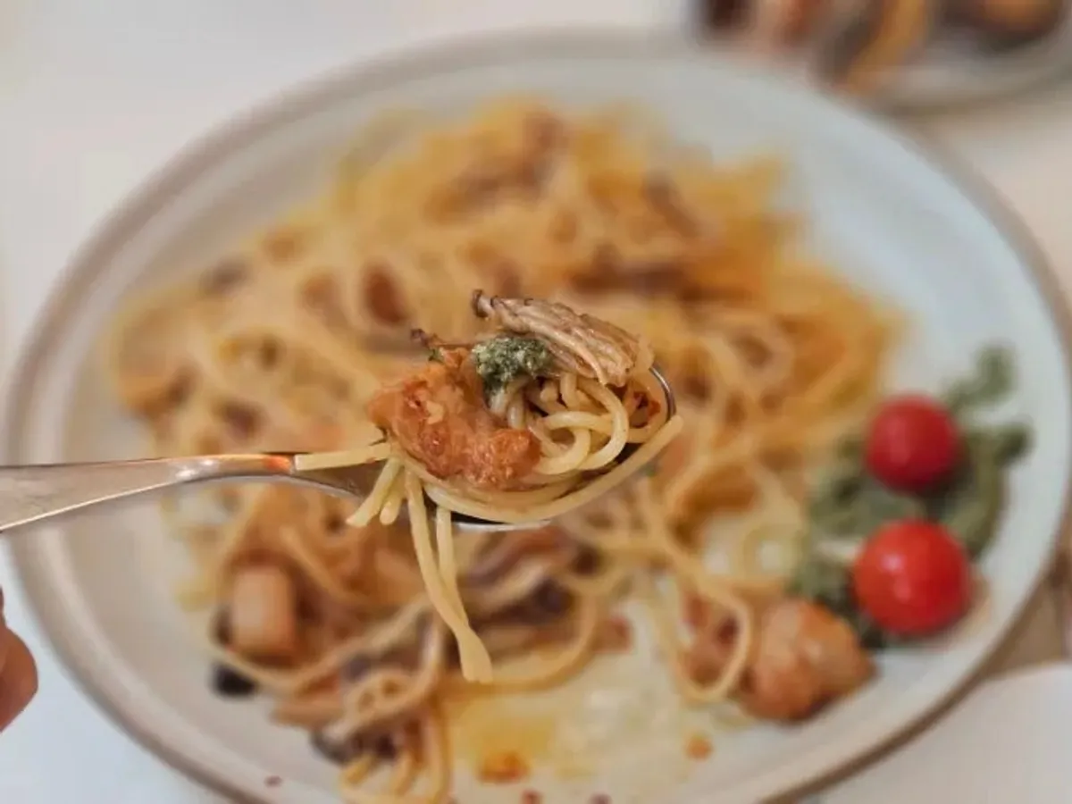 A plate of Choi Dining's pork jowl wild garlic oil pasta
