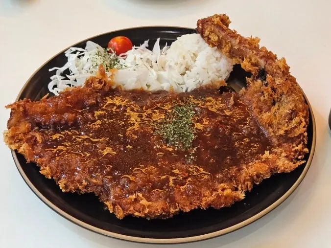Choi Dining's bone-in tonkatsu served with the bone attached