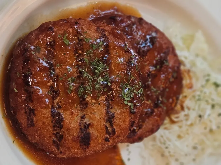 Close-up of two pieces of hamburg steak