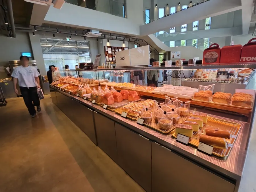 Assorted bread varieties on the bakery shelves at Choi Main Branch