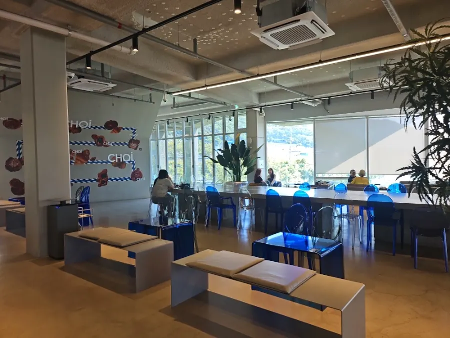 Interior of the 2nd-floor café at Choi Main Branch with generously spaced seating