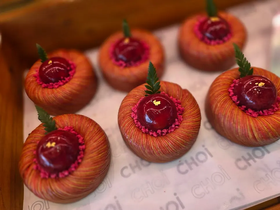 Finely layered pastry topped with red decoration