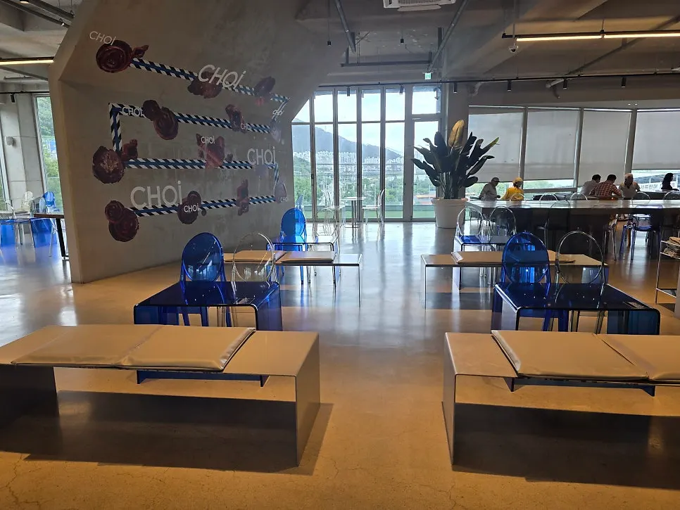 Second-floor table seating with blue chairs
