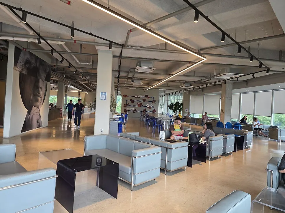 Spacious second-floor café area with full-length windows