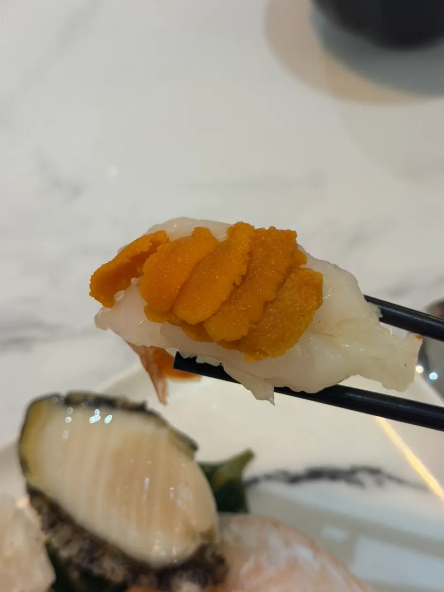 Thick-cut sushi topped with whole abalone
