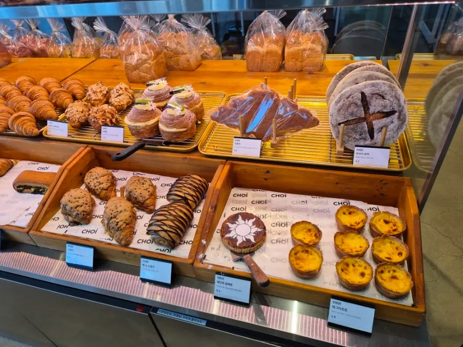 Bakery counter filled with a variety of breads