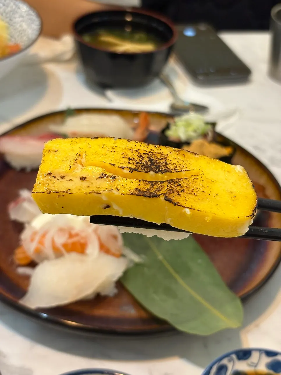 A moist piece of egg sushi