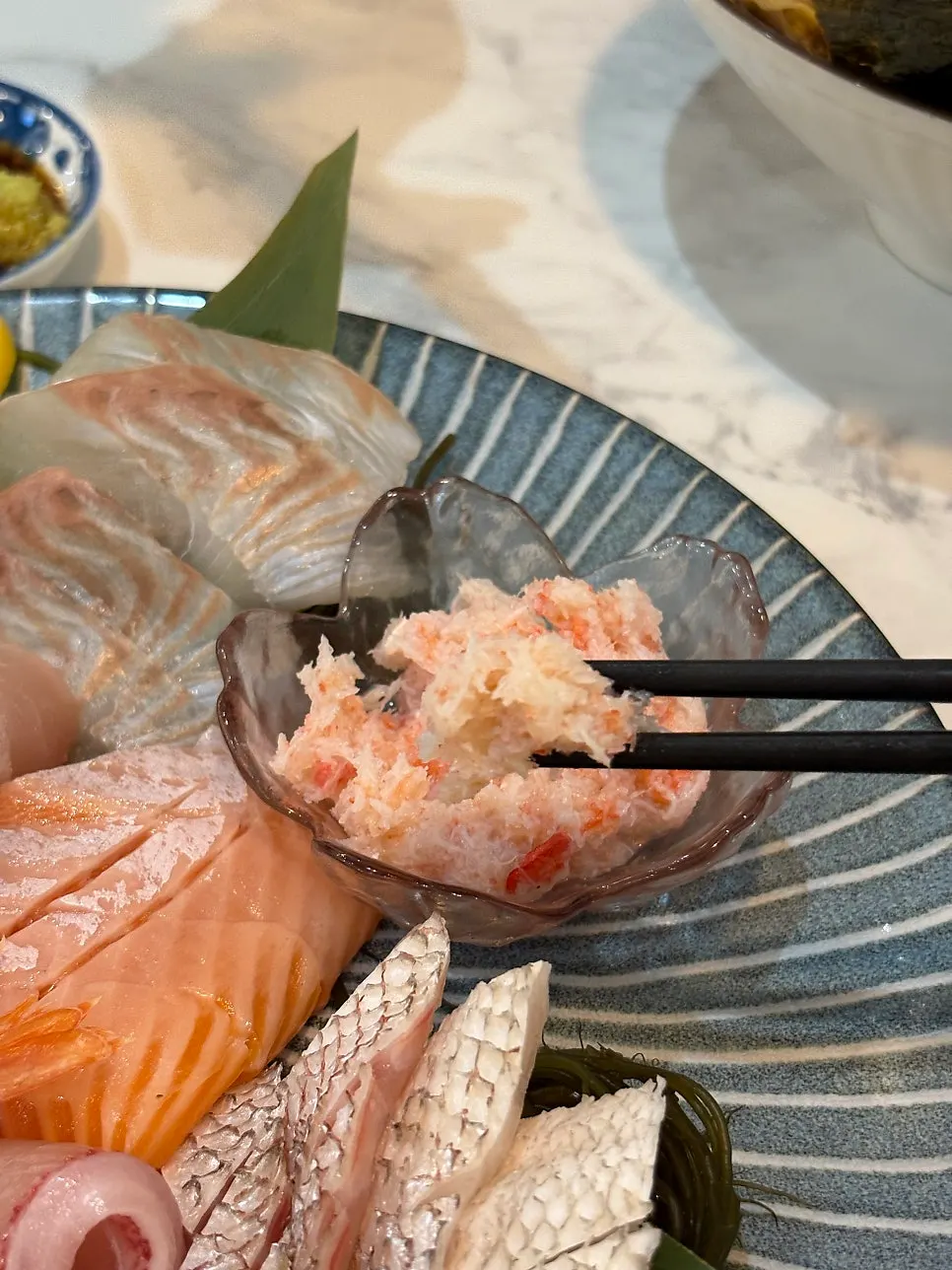 Crab meat sashimi with visible grain