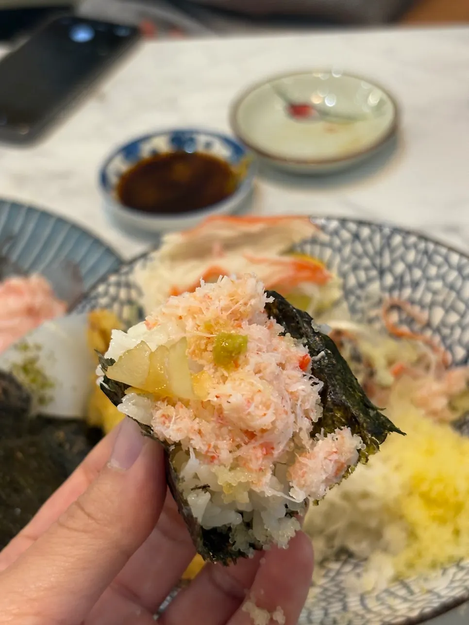 Wrapping salmon and flying fish roe in nori with kaisendon