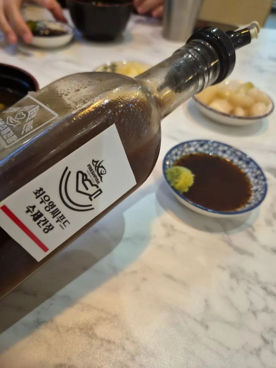 Soy sauce dish placed alongside the sushi