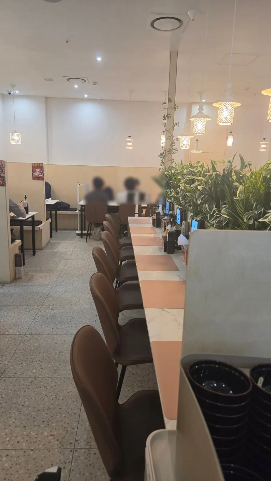 Restaurant interior with counter and table seating