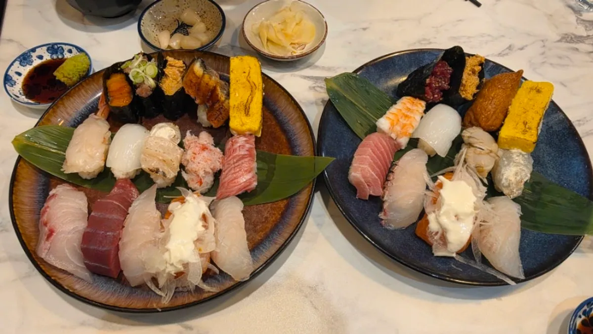 Two plates of mixed sushi and special sushi