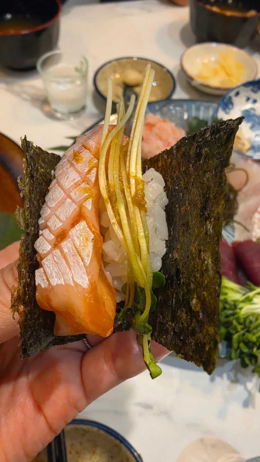 Makizushi with rice and sprouts wrapped in added seaweed