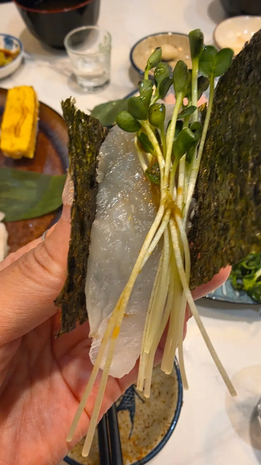 A bite of sushi wrapped in makizushi style