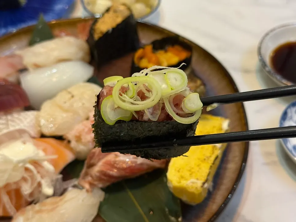 Gunkan sushi piled generously with ingredients