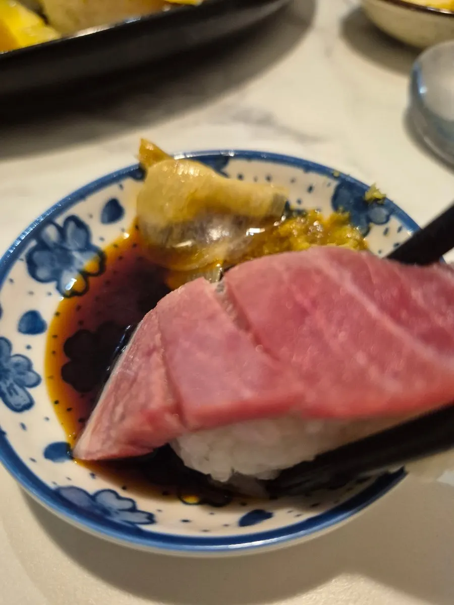Close-up of sushi topped with wasabi