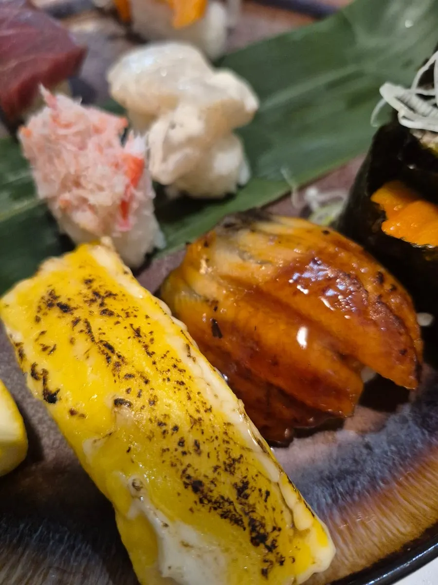 A piece of flounder sashimi dipped in chojang