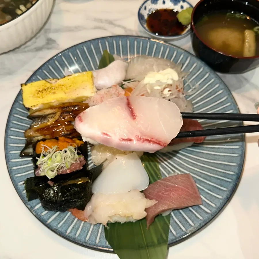 Table set for two with premium sushi and side dishes